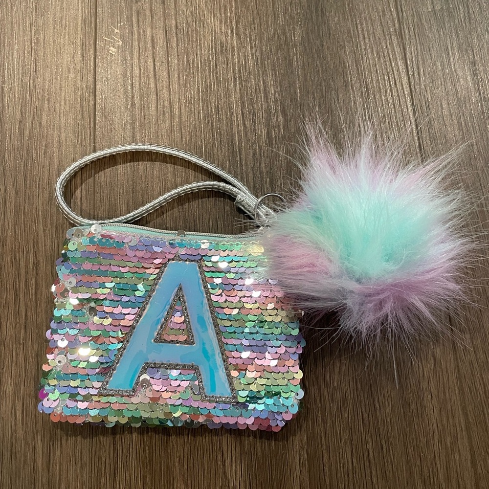 A multicolored pompom walet